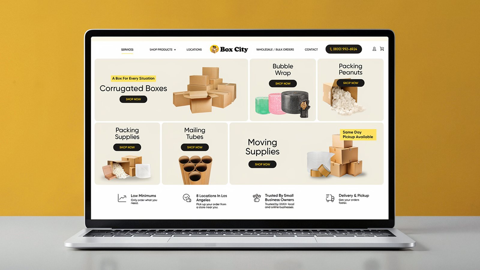 Box City packaging ecommerce website design mockup displayed on a laptop